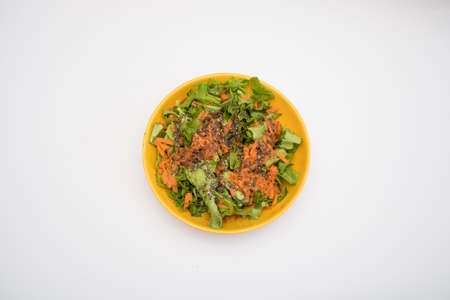 Simple salad with carrots and chia seeds for breaking a fast isolated on white backgroundの写真素材