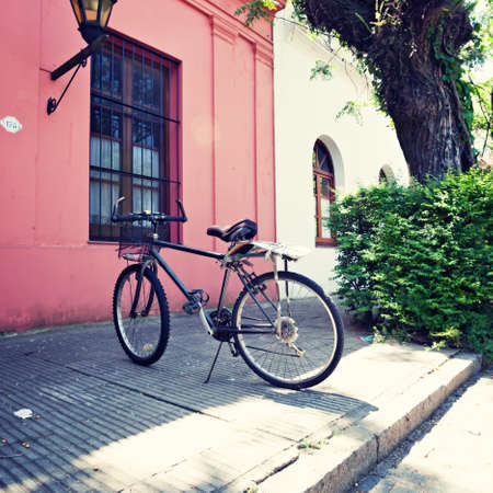 Parked bicycle in a quiet streetの写真素材