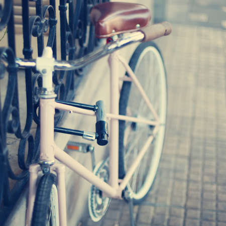 Pink vintage bicycle in the streetの写真素材