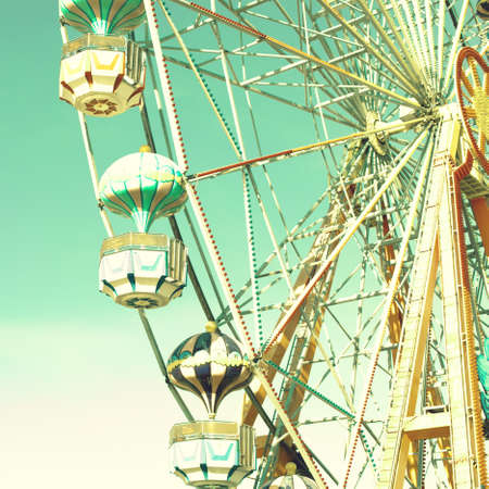 Vintage ferris wheel over turquoise skyの写真素材