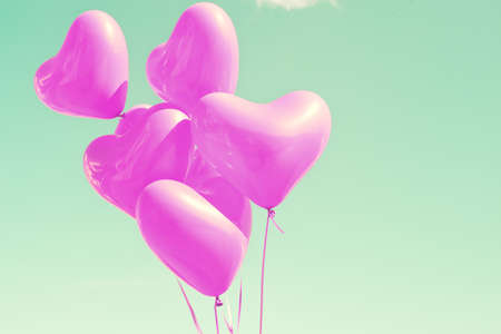 Bunch of purple heart-shaped balloonsの写真素材