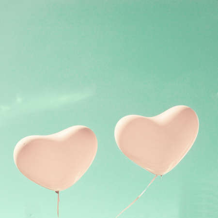 Two pink heart-shaped balloonsの写真素材