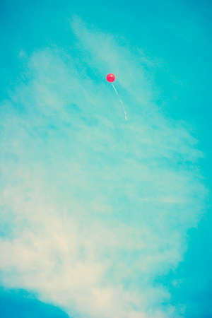 Red balloon flyingの写真素材
