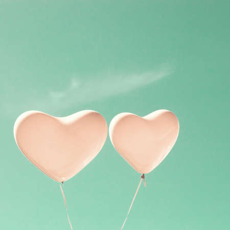 Two pink heart-shaped balloonsの写真素材