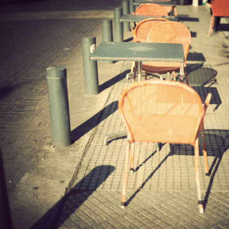 Chairs of an outdoors cafeの写真素材
