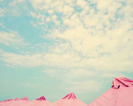 Vintage summer beach with pink umbrellasの写真素材