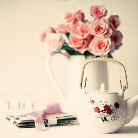 Bouquet of soft pink roses and japanese teapotの写真素材