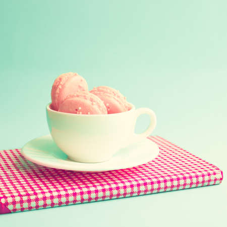 Macaroons in a coffee cupの写真素材