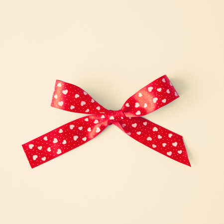 Red silk bow with heartsの写真素材