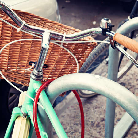 Vintage turquoise bicycle with basketの写真素材