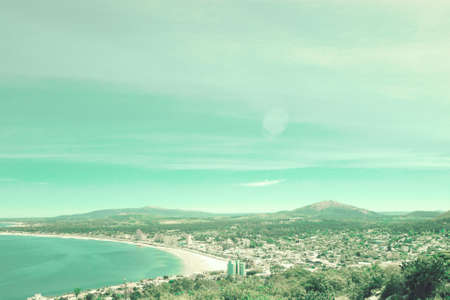 Resort town and bay seen from a hillの写真素材