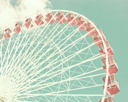 Vintage pastel ferris wheel over turquoise skyの写真素材