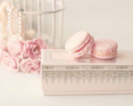 Vintage roses and pearls with macaroons over boxの写真素材