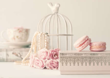 Vintage roses and pearls with macaroons over boxの写真素材