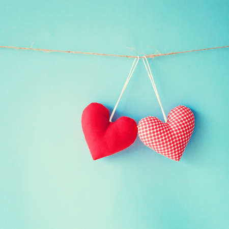 Cotton hearts hanging from a clothes lineの写真素材