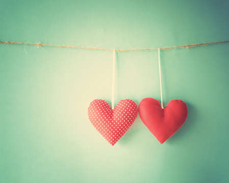 Cotton hearts hanging from a clothes lineの写真素材