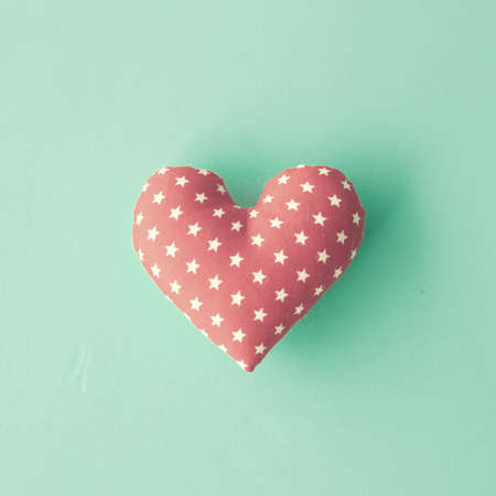 Vintage cotton stuffed heart over blue の写真素材