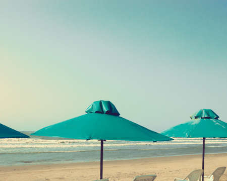 Vintage summer beach and umbrellasの写真素材