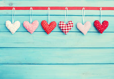 Vintage hanging stuffed heartsの写真素材
