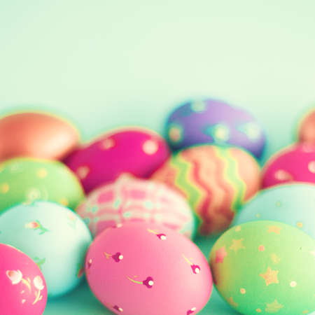 Vintage pastel easter eggs over mint backgroundの写真素材