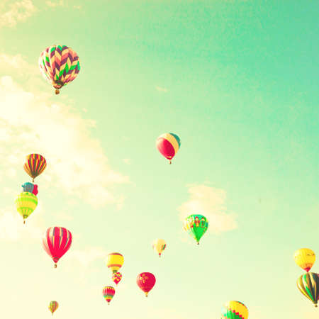 Vintage hot air balloons over mint skyの写真素材