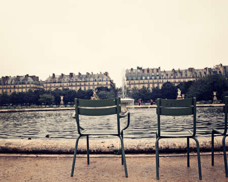 Chairs by a pond in the Tuileries Gardenの写真素材