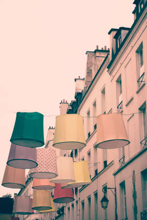 Linen lamps hanging above a Paris streetの写真素材