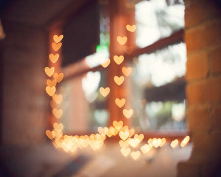 Cafe window with heart shaped bokeh overlayの写真素材