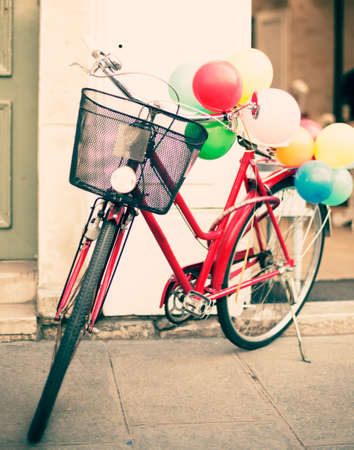 Vintage red bicycle with balloons