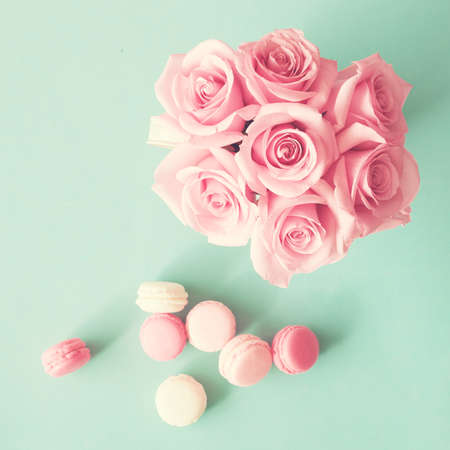 Pastel macarons and roses over mintの写真素材