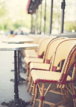 Outdoors chairs and tables of a cafe in Parisの写真素材
