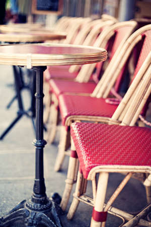 Outdoors chairs and tables of a cafe in Parisの写真素材