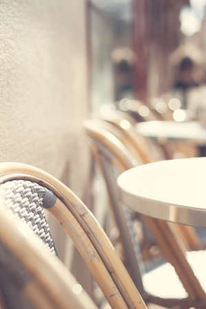 Outdoors chairs and tables of a cafe in Parisの写真素材