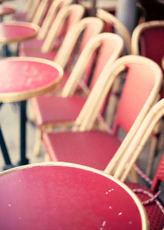 Outdoors chairs and tables of a cafe in Parisの写真素材