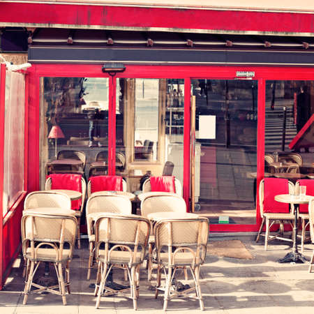 Outdoors chairs and tables of a cafe in Parisの写真素材