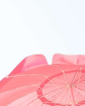 Vintage pink beach parasolの写真素材