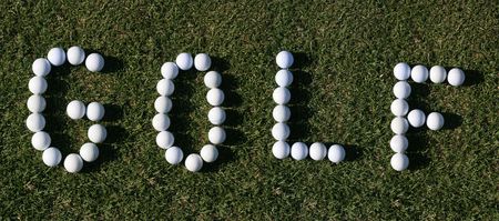 Golf ball lying close to the holeの写真素材