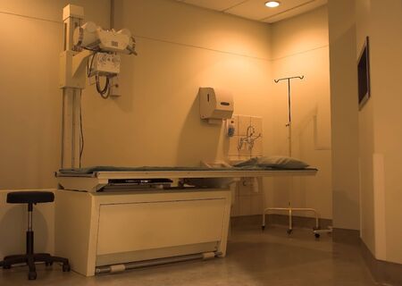 Hospital room with bed and scan machineの写真素材