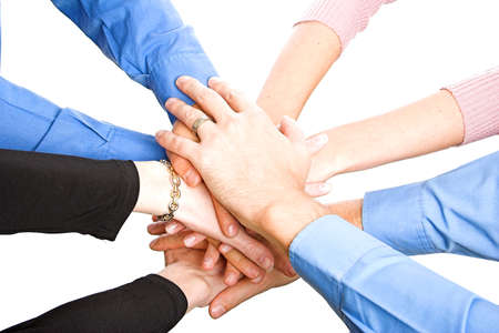 team with arms together in cooperation to look for success - isolated over a white background