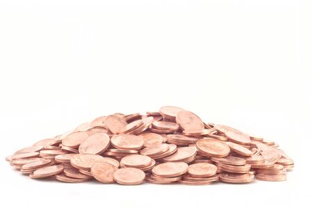 Coins are laid out abreast on a white background.の写真素材
