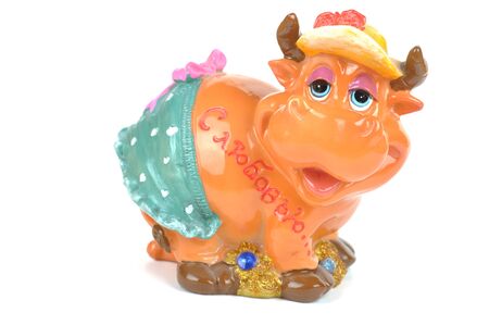 Figurine of a cow on white background.の写真素材