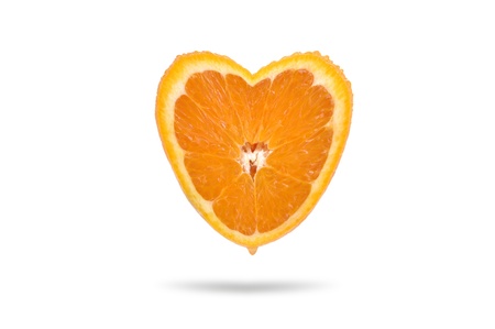 Juicy orange in the form of heart isolated on a white background.の写真素材