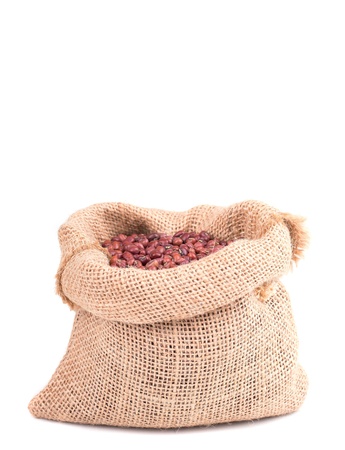 red soybeans in a wooden bowl on a wooden backgroundの写真素材