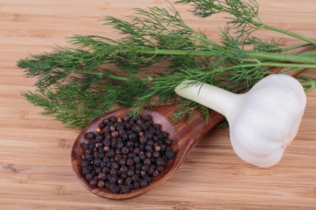 fennel,  peppers and garlic on a wooden backgroundの写真素材