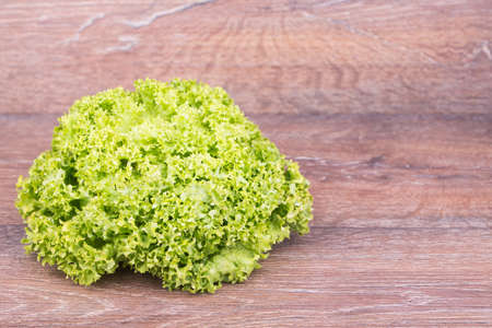 Fresh Lettuce salad on wooden backgroundの写真素材