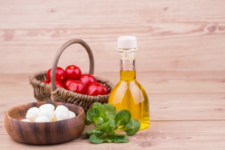 Fresh vegetables with tomatos on a wooden  backgroundの写真素材