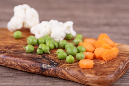 fresh vegetables for soup on a wooden backgroundの写真素材