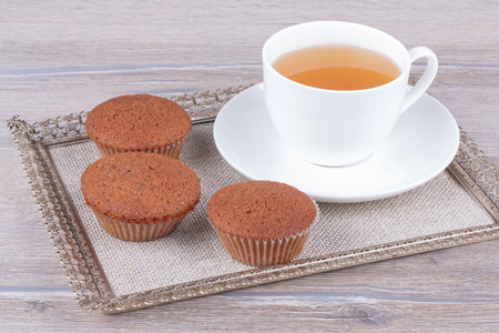 tasty homemade muffins cakes on wooden の写真素材