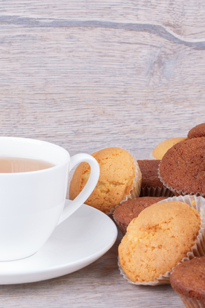 tasty homemade muffins cakes on wooden の写真素材