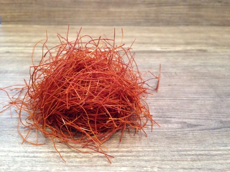 Chili thread on wooden background